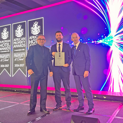 Celebrating the award at the Royal Lancaster Hotel Oktay Uyaroğlu, Mehmet Karaaslan and Stuart Shield posing with the award plaque